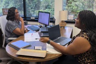 Sissy Swift and Senya Simmons working together on a project.